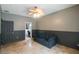 Multi-purpose room with a couch and adjacent bathroom access at 10212 Grant Creek Dr, Tampa, FL 33647