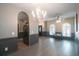 Living room with hardwood floors, chandelier, and archways at 10212 Grant Creek Dr, Tampa, FL 33647