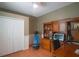 Home office with built-in shelving and a work desk at 10212 Grant Creek Dr, Tampa, FL 33647