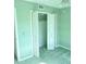 Light green bedroom with double door closet at 10604 Carrollbrook Ln, Tampa, FL 33618