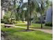 Landscaped community with walking path and seating at 10604 Carrollbrook Ln, Tampa, FL 33618