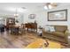 Bright dining room features hardwood floors and a vintage table at 11040 126Th Ter, Largo, FL 33778