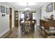 Formal dining room with hardwood floors and a vintage dining set at 11040 126Th Ter, Largo, FL 33778