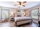 Large main bedroom with a king-size bed and plenty of natural light at 11078 Hemlock Warbler Rd, Weeki Wachee, FL 34614