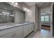 Elegant bathroom with a double vanity and granite countertops at 11976 Blazing Star Dr, Venice, FL 34293