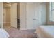 Bedroom with two twin beds, a closet, and access to another room at 11976 Blazing Star Dr, Venice, FL 34293