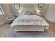 Bedroom with queen-size bed and an armchair at 11976 Blazing Star Dr, Venice, FL 34293