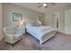 Spacious bedroom with a comfortable bed and plenty of natural light at 11976 Blazing Star Dr, Venice, FL 34293