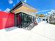 Modern building with glass front, multiple bikes and scooters for rent at 11976 Blazing Star Dr, Venice, FL 34293
