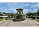 Gated community entrance with landscaping and security at 11976 Blazing Star Dr, Venice, FL 34293