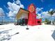 Modern red building with large windows, waterfront view at 11976 Blazing Star Dr, Venice, FL 34293
