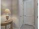 A hallway with a small table and access to other rooms at 11976 Blazing Star Dr, Venice, FL 34293