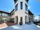 Bright Ice Cream shop exterior, featuring outdoor seating and a modern design at 11976 Blazing Star Dr, Venice, FL 34293