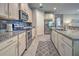 Modern kitchen with stainless steel appliances and granite countertops at 11976 Blazing Star Dr, Venice, FL 34293