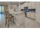Modern kitchen with island and stainless steel appliances at 11976 Blazing Star Dr, Venice, FL 34293