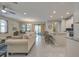 Open living room features a neutral palette and ample natural light at 11976 Blazing Star Dr, Venice, FL 34293