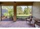 Spacious screened porch overlooking a lush green landscape at 11976 Blazing Star Dr, Venice, FL 34293