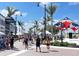 Vibrant town square with pedestrians and various vendors at 11976 Blazing Star Dr, Venice, FL 34293