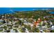 Aerial view of neighborhood featuring mature trees, and access to the ocean at 1612 Sunset Dr, Tarpon Springs, FL 34689