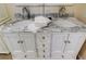 Double vanity bathroom with marble countertop and modern fixtures at 1612 Sunset Dr, Tarpon Springs, FL 34689