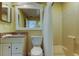 Clean bathroom with updated vanity and shower at 1612 Sunset Dr, Tarpon Springs, FL 34689