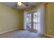 Bedroom with French doors leading to a pool view at 1612 Sunset Dr, Tarpon Springs, FL 34689