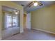 Bedroom featuring mirrored closet and access to backyard pool at 1612 Sunset Dr, Tarpon Springs, FL 34689