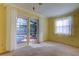 Bedroom with carpet flooring, a ceiling fan and french doors with view of a pool area at 1612 Sunset Dr, Tarpon Springs, FL 34689