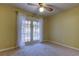 Bedroom with French doors opening to a view of the pool at 1612 Sunset Dr, Tarpon Springs, FL 34689