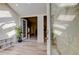 Bright foyer with wood-look tile floors, a glass front door and views of the main living area at 1612 Sunset Dr, Tarpon Springs, FL 34689