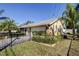 Well-maintained home with attached garage and stone accents and tidy landscaping at 1612 Sunset Dr, Tarpon Springs, FL 34689