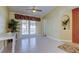 Gathering room with tiled floors, sliding doors to pool, and ceiling fan at 1612 Sunset Dr, Tarpon Springs, FL 34689