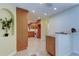 Open concept kitchen with granite counters, wood cabinets, and breakfast bar at 1612 Sunset Dr, Tarpon Springs, FL 34689