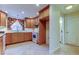 Bright kitchen with light wood cabinets and granite countertops at 1612 Sunset Dr, Tarpon Springs, FL 34689