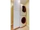 Laundry closet with stacked washer and dryer at 1612 Sunset Dr, Tarpon Springs, FL 34689