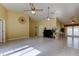 Spacious living room featuring tile floors, high ceilings and access to the pool at 1612 Sunset Dr, Tarpon Springs, FL 34689