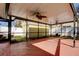 Spacious screened-in patio area with ceiling fans, perfect for outdoor relaxation and entertainment at 1612 Sunset Dr, Tarpon Springs, FL 34689