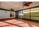 Relaxing screened patio offers seamless indoor-outdoor living and two ceiling fans at 1612 Sunset Dr, Tarpon Springs, FL 34689
