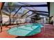 Private screened in pool with a well maintained deck at 1612 Sunset Dr, Tarpon Springs, FL 34689