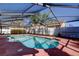 Private screened in pool with a well maintained deck and a beautiful open sky at 1612 Sunset Dr, Tarpon Springs, FL 34689
