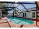 Relax in this screened in pool with clear views of the sky at 1612 Sunset Dr, Tarpon Springs, FL 34689