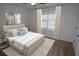 Main bedroom with neutral tones and carpeted floor at 16769 Parker River St, Wimauma, FL 33598