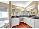 Elegant bathroom with double vanity, granite countertop, and soaking tub at 18817 Avenue Biarritz, Lutz, FL 33558