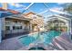 Large screened pool and spa with patio at 18817 Avenue Biarritz, Lutz, FL 33558