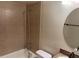 Clean bathroom with updated vanity, tiled shower/tub, and large mirror at 21038 Voyager Blvd # 4, Land O Lakes, FL 34638