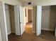 Spacious bedroom with double closets and wood-look floors at 21038 Voyager Blvd # 4, Land O Lakes, FL 34638
