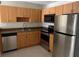 Well-equipped kitchen with stainless steel appliances and granite countertops at 21038 Voyager Blvd # 4, Land O Lakes, FL 34638