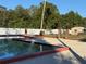 Community pool with surrounding deck and landscaping at 21038 Voyager Blvd # 4, Land O Lakes, FL 34638