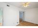 Bedroom with sliding glass doors and wood-look floors at 224 Sky Loch E Dr, Dunedin, FL 34698
