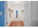 Large walk-in closet with wood-look floors and shelving at 224 Sky Loch E Dr, Dunedin, FL 34698